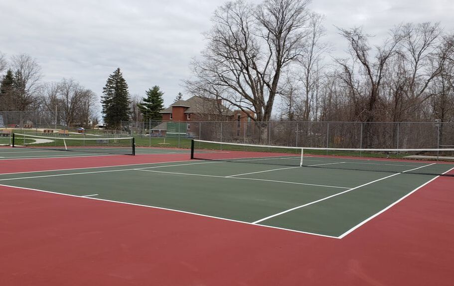 Tennis Courts are refinished and ready to use!